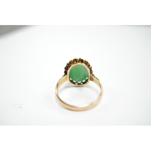 1939 - A mid 20th century yellow metal and single stone cabochon jade set ring, size Q, gross weight 5.6 gr... 