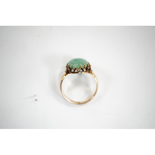 1939 - A mid 20th century yellow metal and single stone cabochon jade set ring, size Q, gross weight 5.6 gr... 