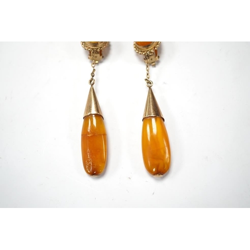 1940 - A pair of yellow metal and two stone amber set drop ear clips, 68mm, gross weight 8 grams. Condition... 