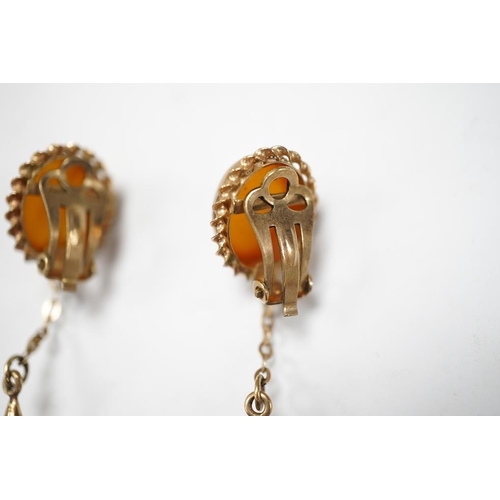 1940 - A pair of yellow metal and two stone amber set drop ear clips, 68mm, gross weight 8 grams. Condition... 