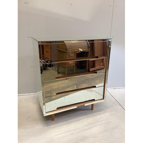 11 - A Stag mirrored chest, width 77cm, depth 46cm, height 92cm. Condition - fair, one glass section dama... 