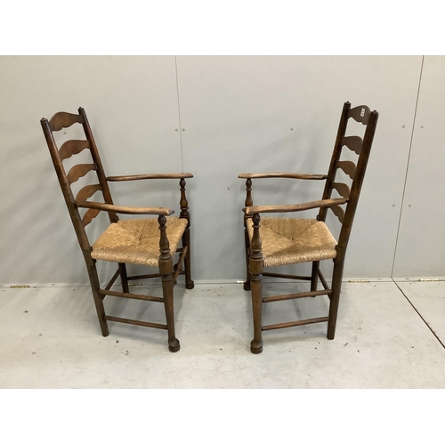 114 - A pair of 19th century beech ladder back elbow chairs, width 54cm, depth 49cm, height 105cm. Conditi... 