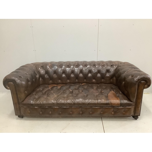 117 - An early 20th century buttoned brown leather Chesterfield sofa, width 200cm, depth 90cm, height 72cm... 