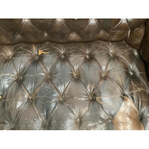 117 - An early 20th century buttoned brown leather Chesterfield sofa, width 200cm, depth 90cm, height 72cm... 