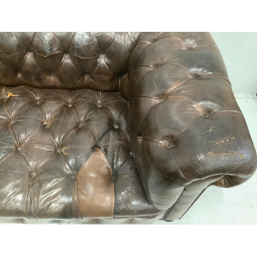 117 - An early 20th century buttoned brown leather Chesterfield sofa, width 200cm, depth 90cm, height 72cm... 