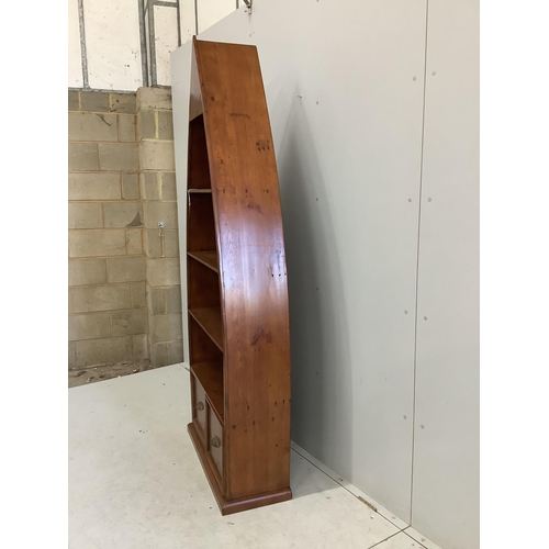 126 - A reproduction Barker and Stonehouse hardwood boat shaped two drawer bookcase, width 83cm, depth 32c... 