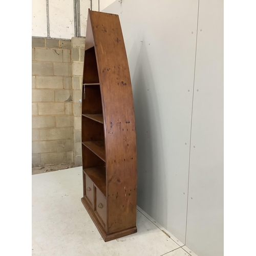 127 - A reproduction Barker and Stonehouse hardwood boat shaped two drawer bookcase, width 83cm, depth 32c... 