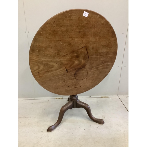 128 - A George III mahogany circular tilt top tea table, diameter 80cm, height 68cm. Condition - poor to f... 