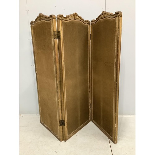 131 - A Victorian style folding giltwood and composition three fold dressing screen, each panel width 62cm... 