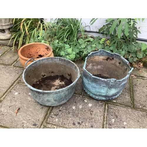 132 - Two copper planters and one terracotta planter, planting removed, largest height 46cm. Condition - a... 