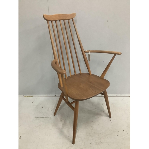 16 - An Ercol Goldsmith's comb back elbow chair, width 61cm, depth 41cm, height 98cm. Condition - fair... 