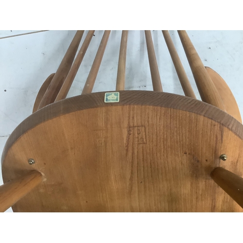 16 - An Ercol Goldsmith's comb back elbow chair, width 61cm, depth 41cm, height 98cm. Condition - fair... 