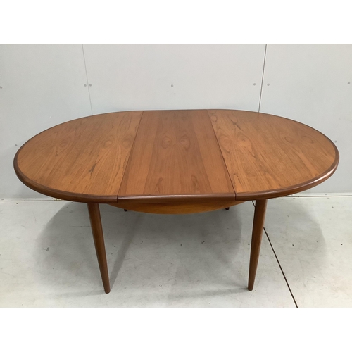 19 - A G Plan Fresco teak dining table and five chairs, one with arms. Table 170cm extended, depth 120cm,... 