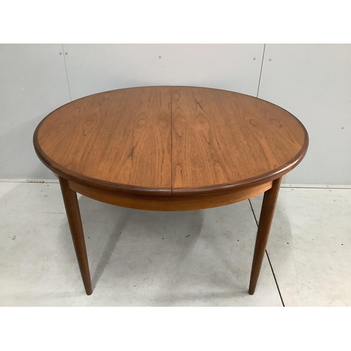 19 - A G Plan Fresco teak dining table and five chairs, one with arms. Table 170cm extended, depth 120cm,... 