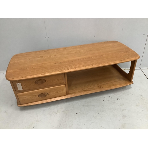 25 - An Ercol Minerva elm television unit, width 124cm, depth 53cm, height 40cm. Condition - good