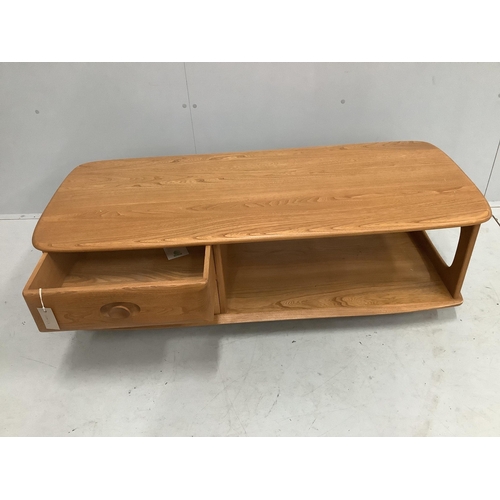 25 - An Ercol Minerva elm television unit, width 124cm, depth 53cm, height 40cm. Condition - good