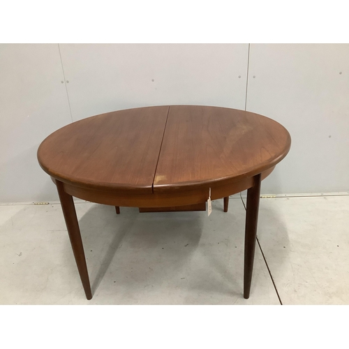 27 - A G plan extending dining table, width 169cm extended, depth 122cm, height 72cm. Condition - fair to... 