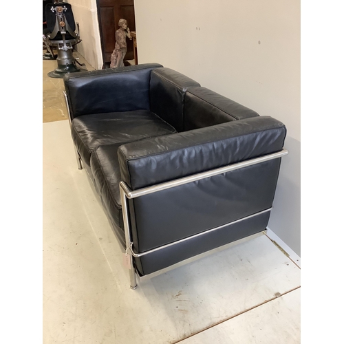 29 - A Le Corbusier style two seater settee, width 130cm, depth 70cm, height 64cm. Condition - fair... 