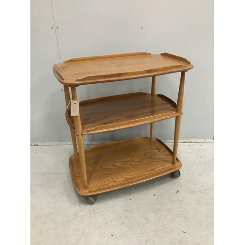 30 - An Ercol Windsor elm three tier trolley, width 71cm, depth 46cm, height 76cm. Condition - fair, top ... 