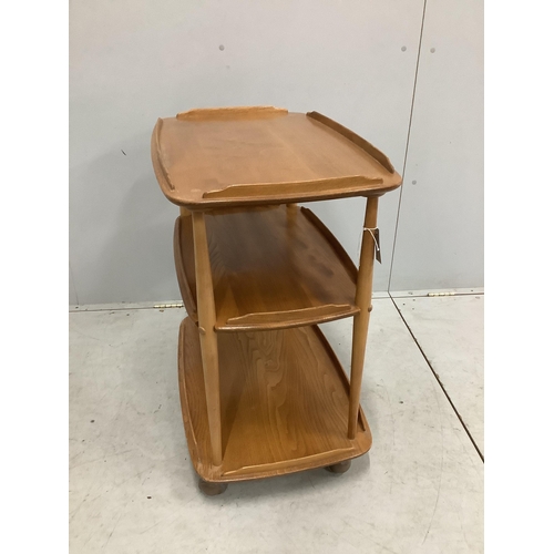 30 - An Ercol Windsor elm three tier trolley, width 71cm, depth 46cm, height 76cm. Condition - fair, top ... 