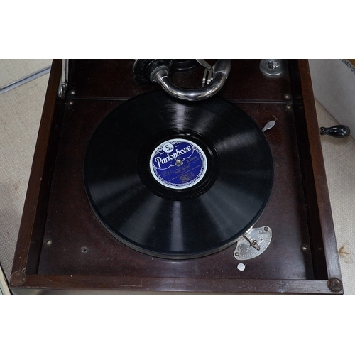 304 - A mahogany cased HMV table top gramophone record player and a small selection of 78 rpm records. Con... 