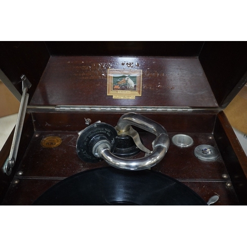 304 - A mahogany cased HMV table top gramophone record player and a small selection of 78 rpm records. Con... 