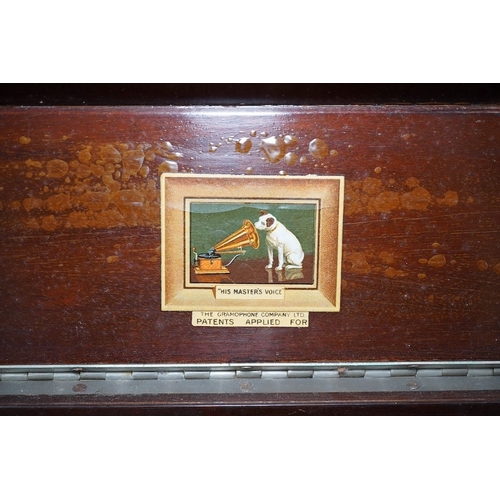 304 - A mahogany cased HMV table top gramophone record player and a small selection of 78 rpm records. Con... 