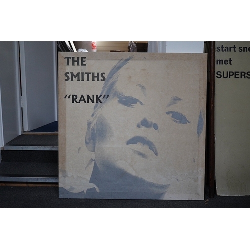 306 - The Smiths interest; a 1980s printed cloth advertising banner mounted on wood stretchers, promoting ... 