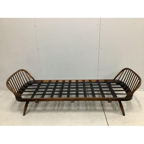 32 - An Ercol day settee, width 208cm, depth 73cm, height 70cm. Condition - fair but missing bolts for si... 