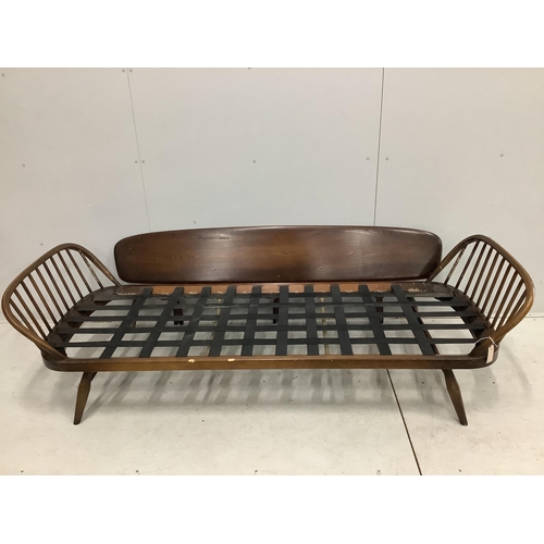 32 - An Ercol day settee, width 208cm, depth 73cm, height 70cm. Condition - fair but missing bolts for si... 