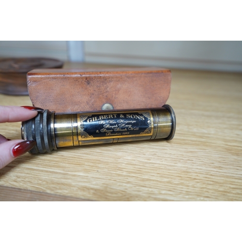 359 - A reproduction 19th century style brass kaleidoscope with panel reading; Gilbert & Sons To Her Maje... 