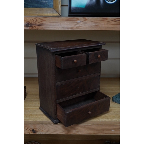 360 - A Victorian miniature mahogany chest of drawers, 27cm high. Condition - poor