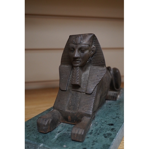 361 - A pair of bronze models of Sphinxes, raised on green serpentine marble bases, 32cm long. Condition -... 