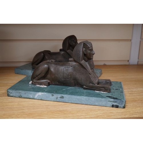 361 - A pair of bronze models of Sphinxes, raised on green serpentine marble bases, 32cm long. Condition -... 