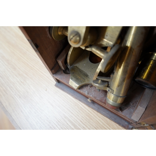 372 - A mahogany cased late 19th century brass microscope by J.H. Steward, 456 West Strand London, with a ... 