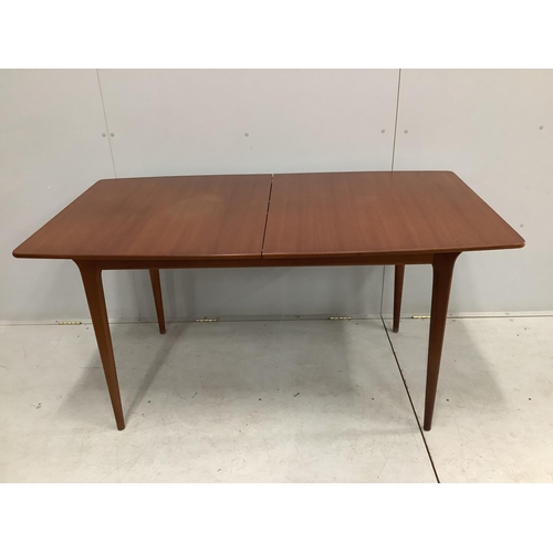 38 - A mid century McIntosh teak extending dining table, width 150cm, depth 82cm, height 74cm together wi... 