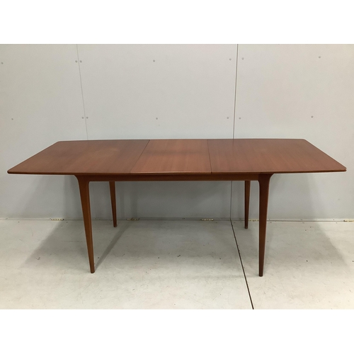 38 - A mid century McIntosh teak extending dining table, width 150cm, depth 82cm, height 74cm together wi... 