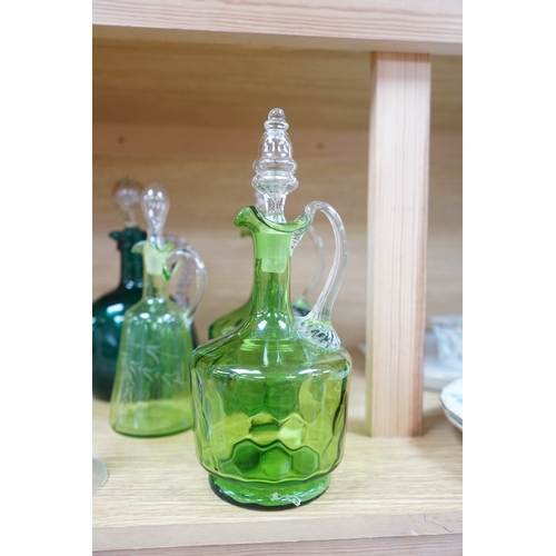 396 - Ten glass items; a pair of green hock glasses, six liqueur decanters, a pedestal table centre and a ... 