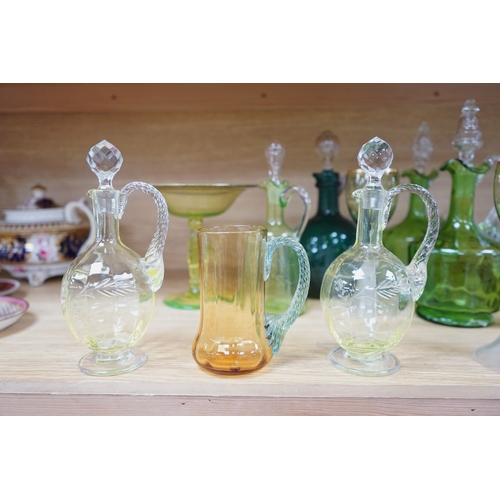 396 - Ten glass items; a pair of green hock glasses, six liqueur decanters, a pedestal table centre and a ... 