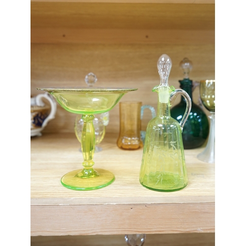 396 - Ten glass items; a pair of green hock glasses, six liqueur decanters, a pedestal table centre and a ... 