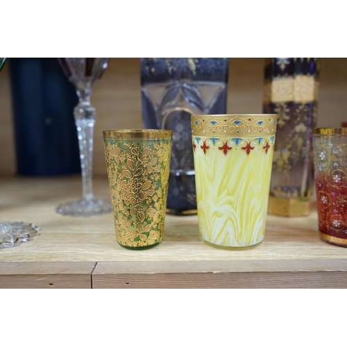 398 - Nine Bohemian decorated glass items including a gilt rimmed and decorated glass inscribed Moser 150... 