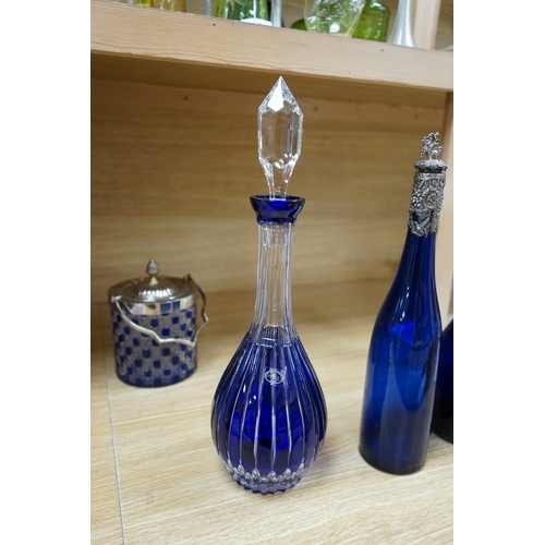 413 - A collection of blue glassware comprising a late 18th century Bristol blue glass decanter and tear d... 