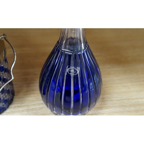 413 - A collection of blue glassware comprising a late 18th century Bristol blue glass decanter and tear d... 