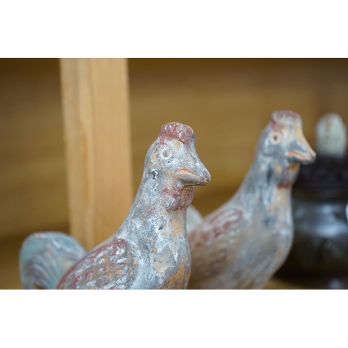 418 - A pair of Chinese pottery figures of cockerels, Han Dynasty or later, height 17cm. Condition - fair... 