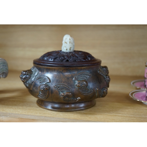 419 - A Chinese bronze censer, with carved wooden cover and jade finial, 17cm high. Condition - good... 