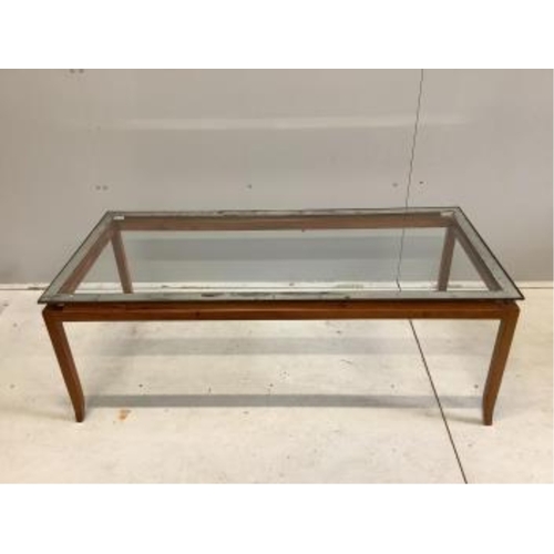 42 - A mid century teak glass top coffee table, width 125cm, depth 58cm, height 45cm. Condition - fair... 