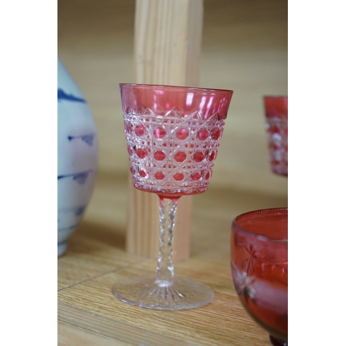 422 - Two cranberry glass liqueur decanters and a collection of various glasses and a bowl, decanters 25cm... 