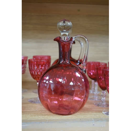 422 - Two cranberry glass liqueur decanters and a collection of various glasses and a bowl, decanters 25cm... 