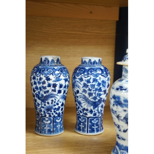 423 - A collection of 19th and 20th century Chinese blue and white vases and tea bowls, largest 21cm high.... 