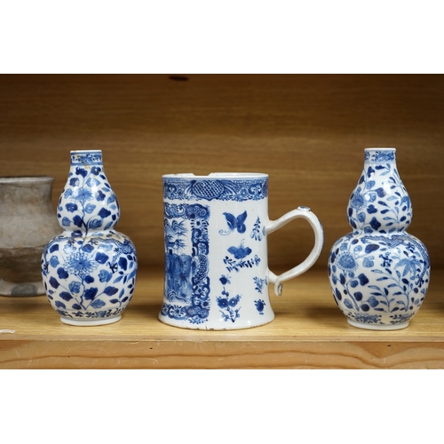 427 - A pair of Chinese blue and white double gourd shaped vases, 19th century and a large export tankard,... 